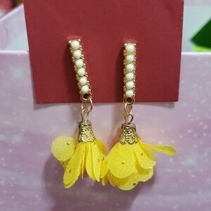 Yellow tassel earrings with faux pearl base. Nwt